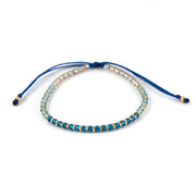 Bracelet femme en perle de verre Miyuki au désigne ombré du bleu Capri au bleu clair et or. Fermoir ajustable.