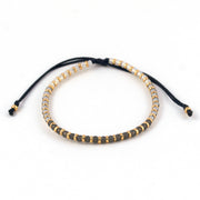 Bracelet femme en perle de verre Miyuki de couleur gris ombré et or avec fil noir. Fermoir ajustable